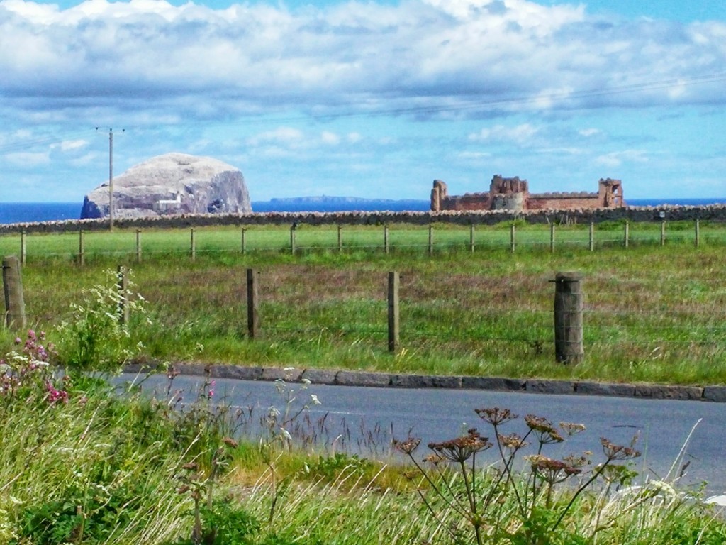 Bass Rock and Tantallon Castle with Isle of May inbetween in the distance